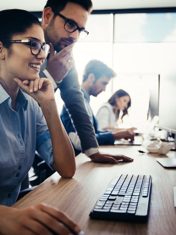 Creative people working in office on computer